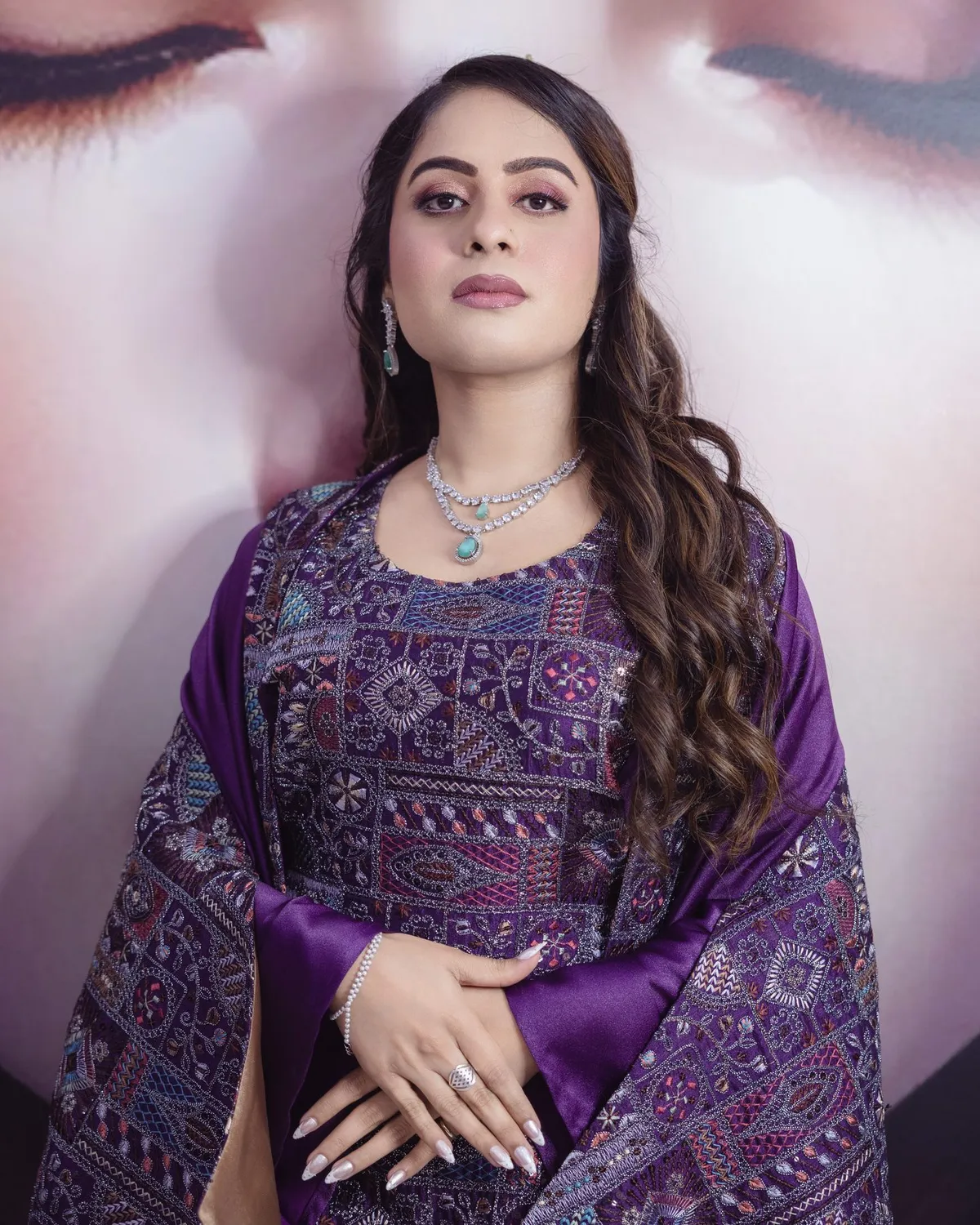 Beauty portrait in a purple outfit against a salon mural · Carpe Diem Salon and Spa