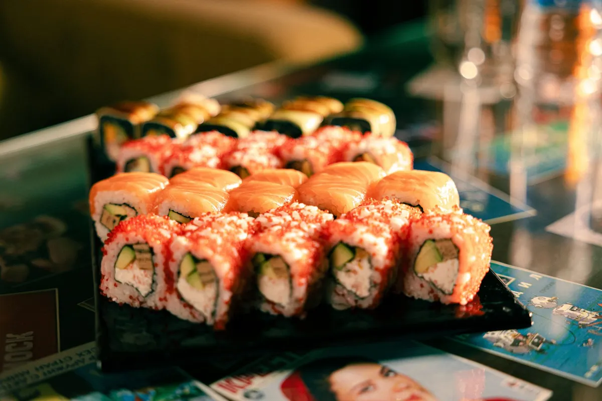 Assorted sushi rolls presented on a serving board · Friends Sushi