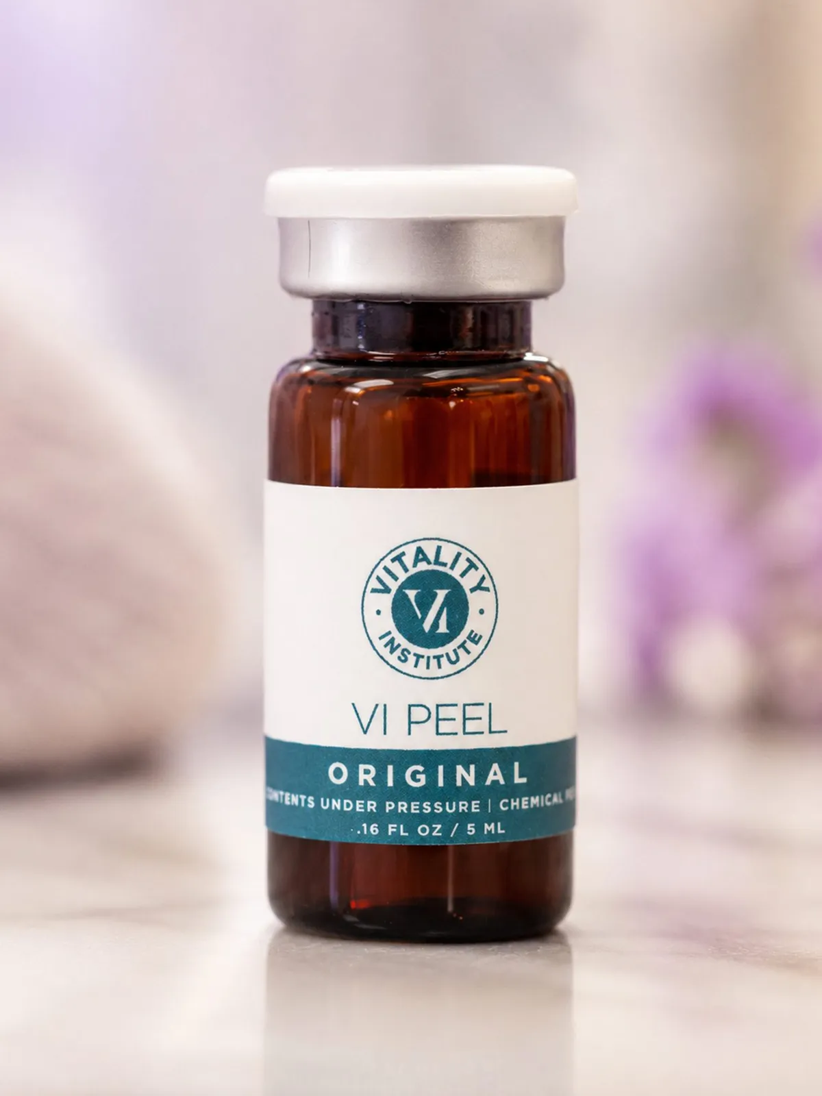 Skincare bottle photographed against a softly blurred background · SKYN Med Spa