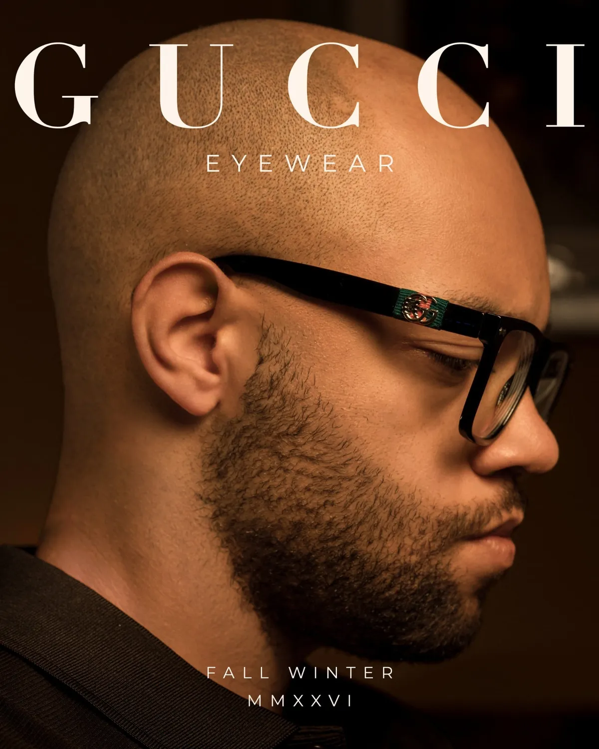 Profile portrait showing the emblem on the temple of black eyewear, warm low-key light · Luxury eyewear, Fall Winter